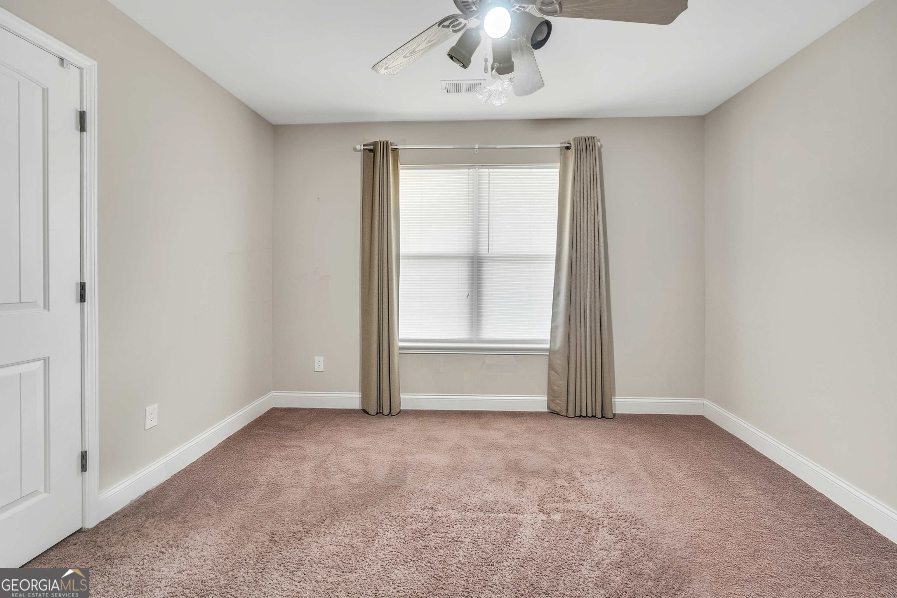 185 Wynn Road McDonough, GA 30252 - Photo 22 of 36 an empty room with a empty space and chandelier fan