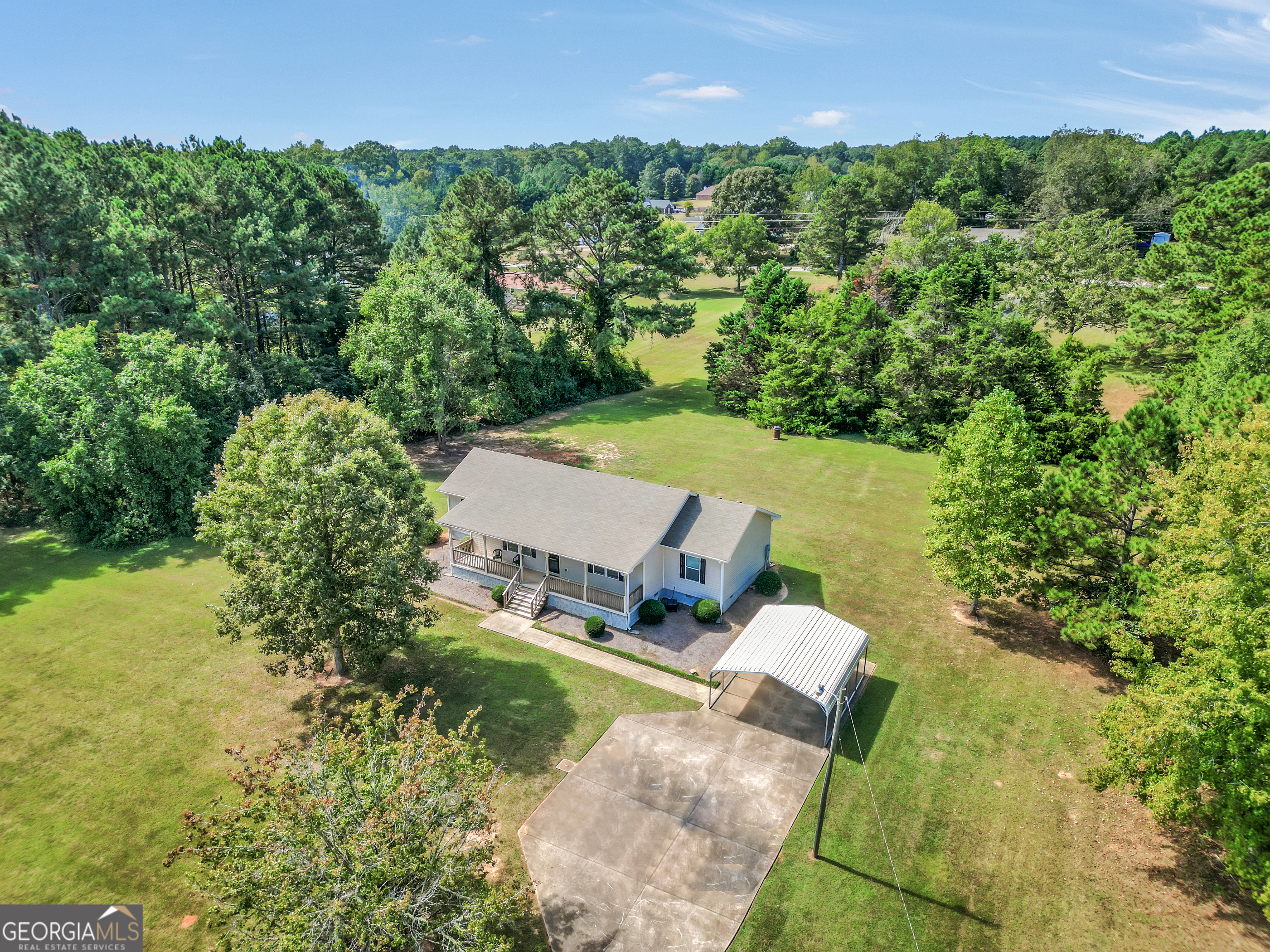 185 Wynn Road McDonough, GA 30252 - Photo 3 of 36 an aerial view of a house with a yard and lake view