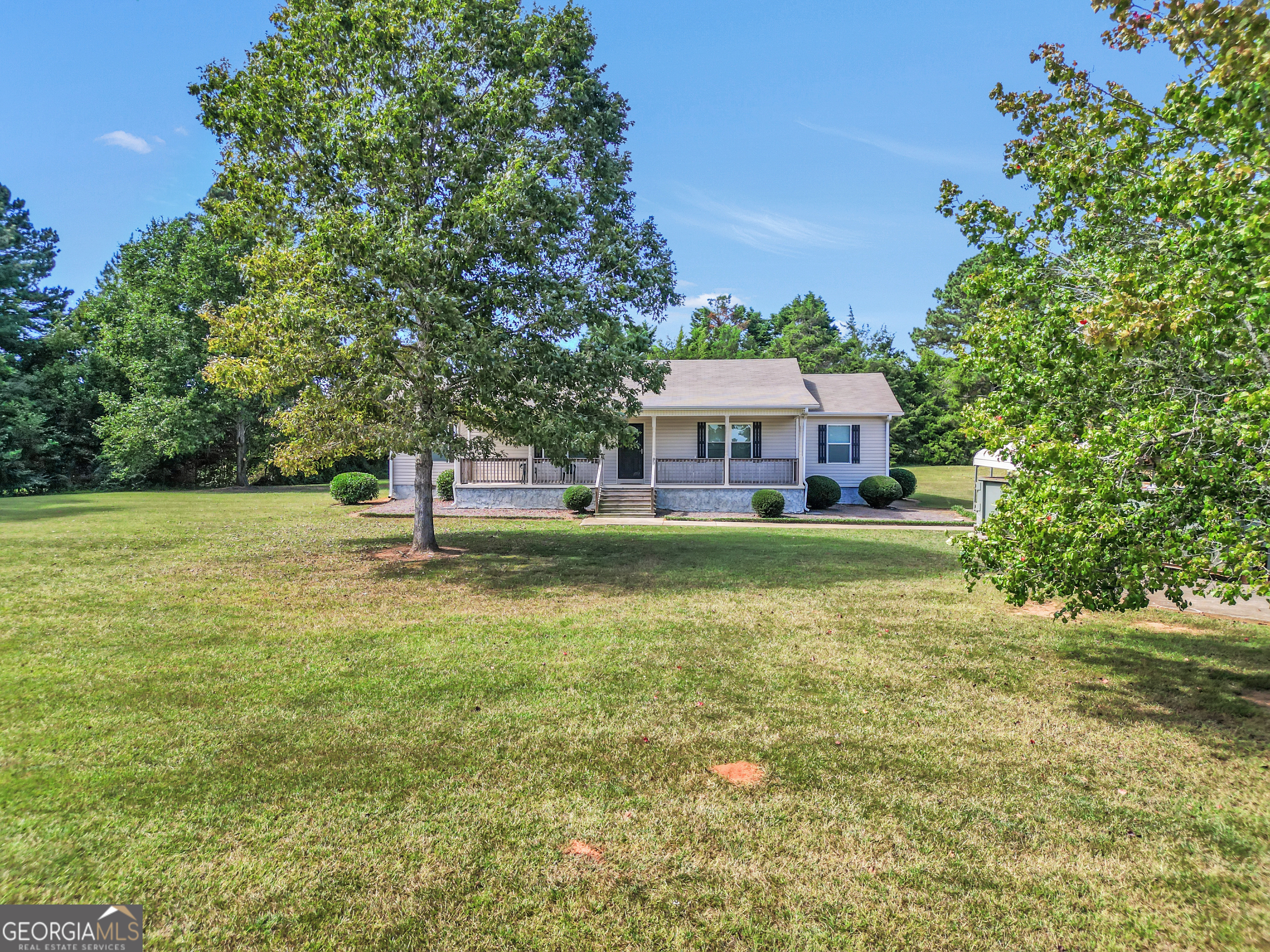 185 Wynn Road McDonough, GA 30252 - Photo 34 of 36 a front view of a house with a yard table and chairs