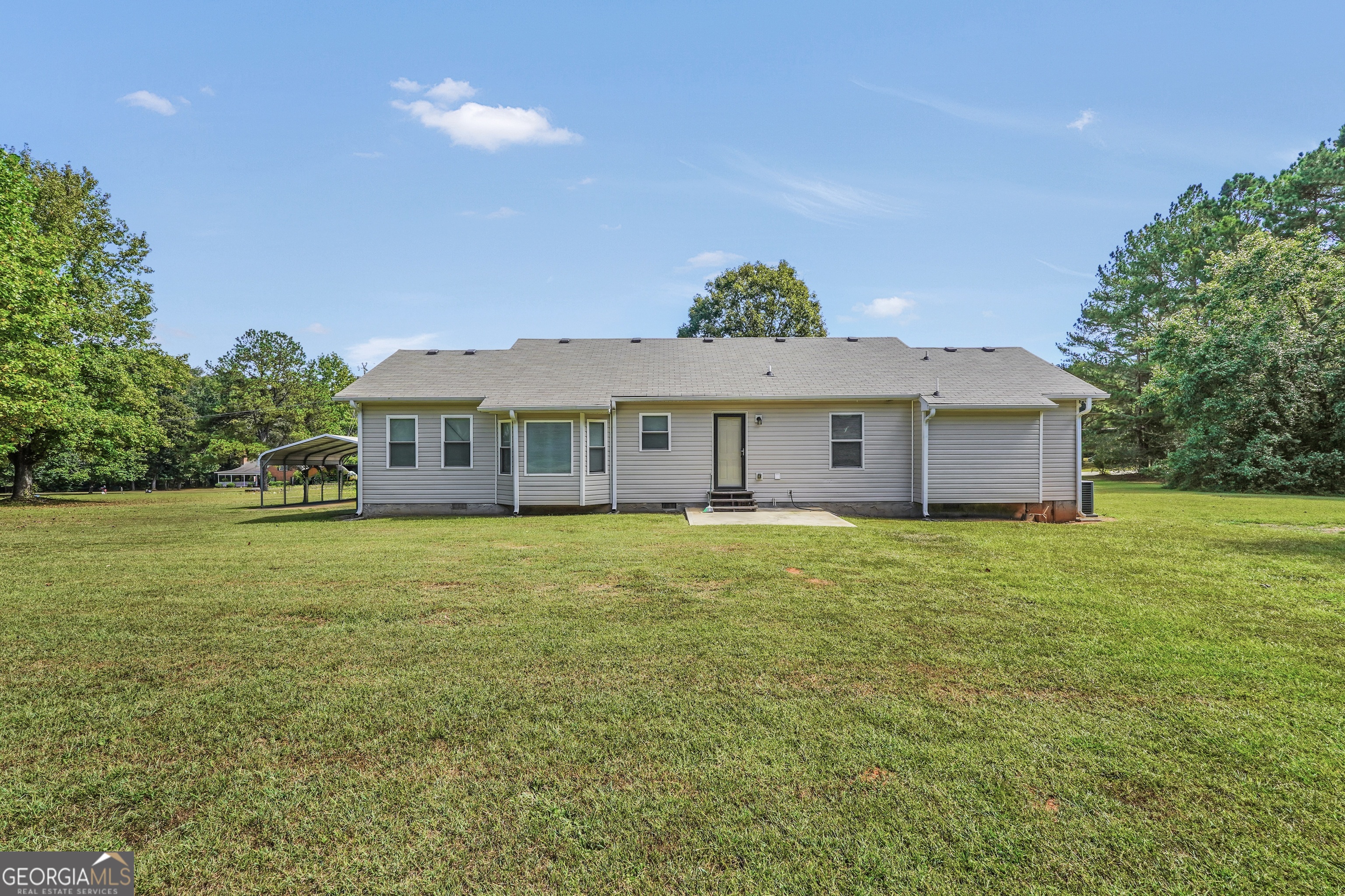 185 Wynn Road McDonough, GA 30252 - Photo 35 of 36 a front view of a house with a garden