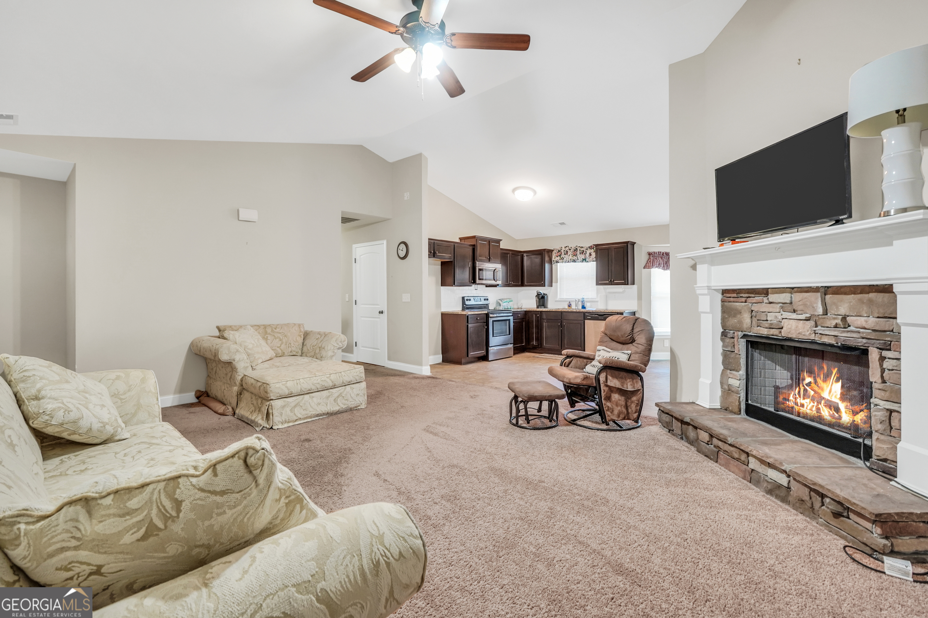 185 Wynn Road McDonough, GA 30252 - Photo 4 of 36 a living room with furniture and a fireplace