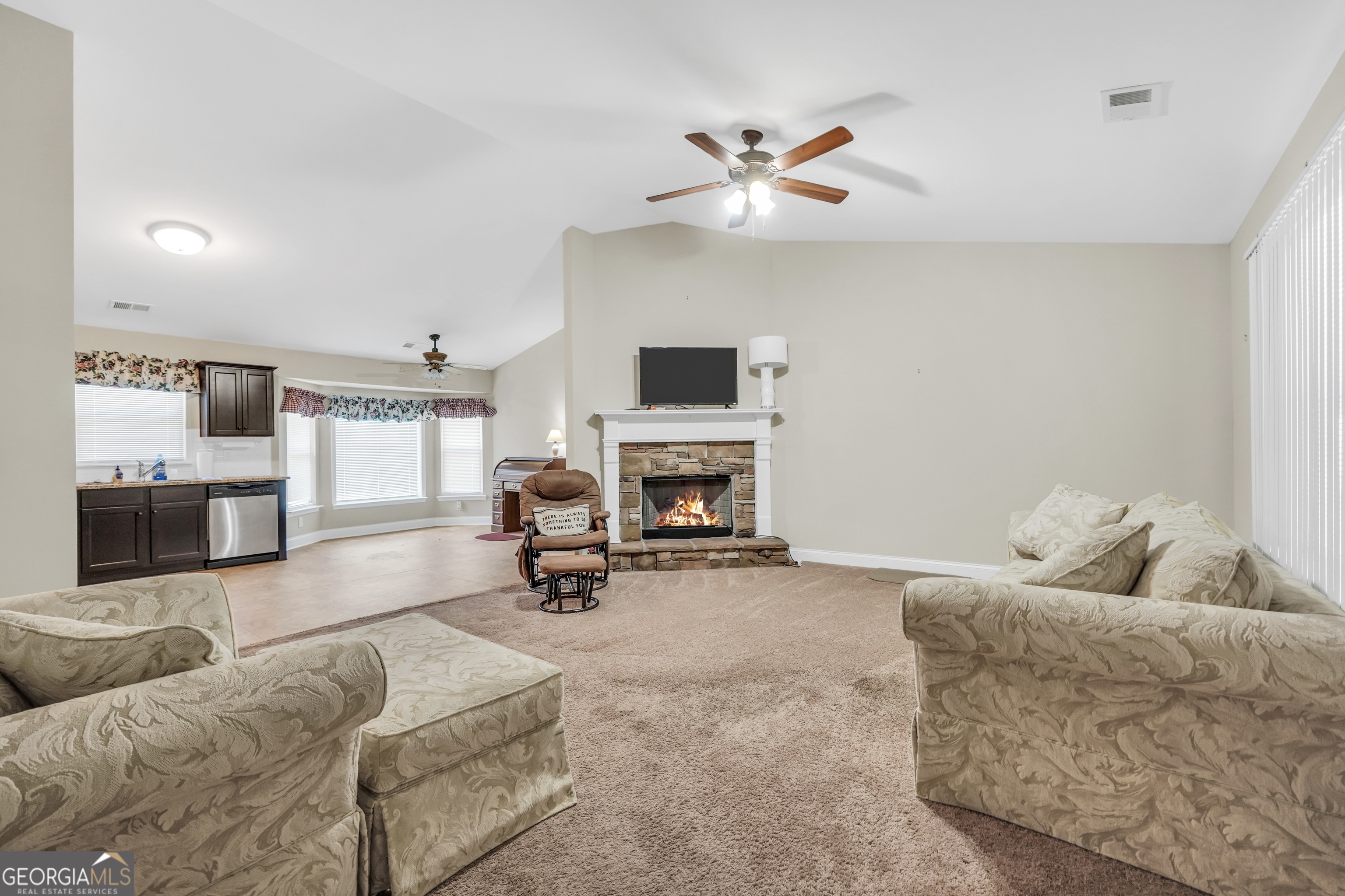 185 Wynn Road McDonough, GA 30252 - Photo 5 of 36 a living room with furniture and a fireplace