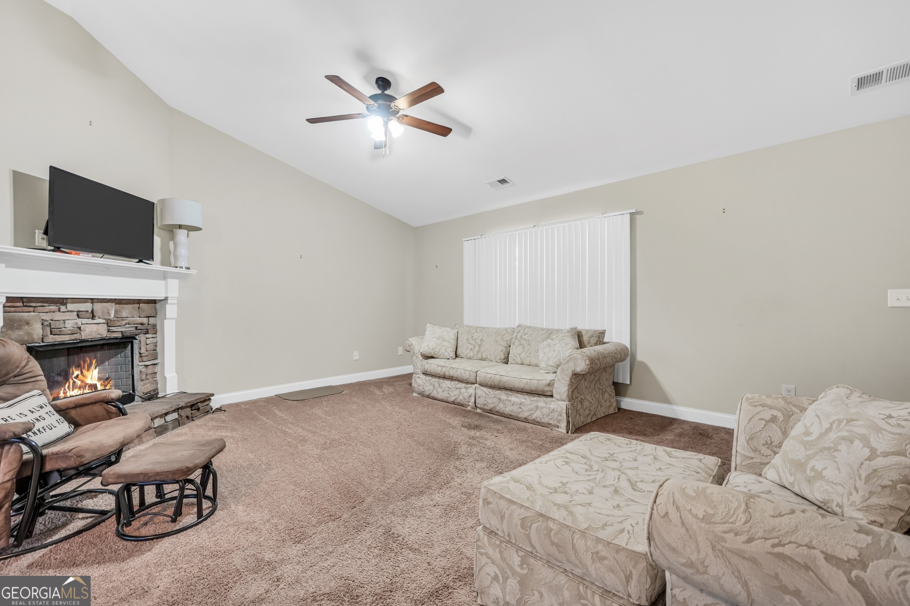 185 Wynn Road McDonough, GA 30252 - Photo 6 of 36 a living room with furniture and a fireplace