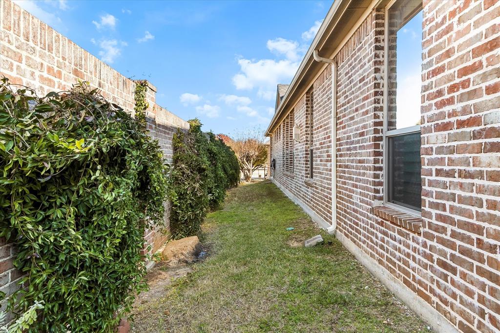 6814 Springwood Lane Garland, TX 75044 - Photo 32 of 35 a view of a pathway of a building
