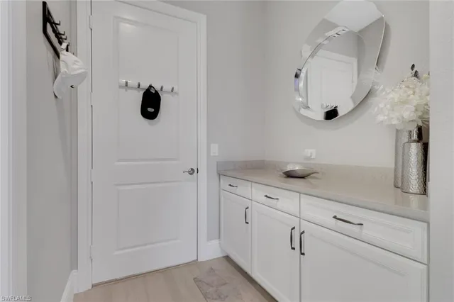a bathroom with a sink and mirror