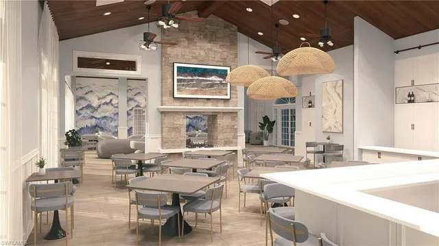 a large room with lots of white furniture and a chandelier