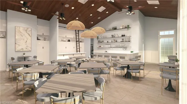 a view of a dining room with furniture and chandelier