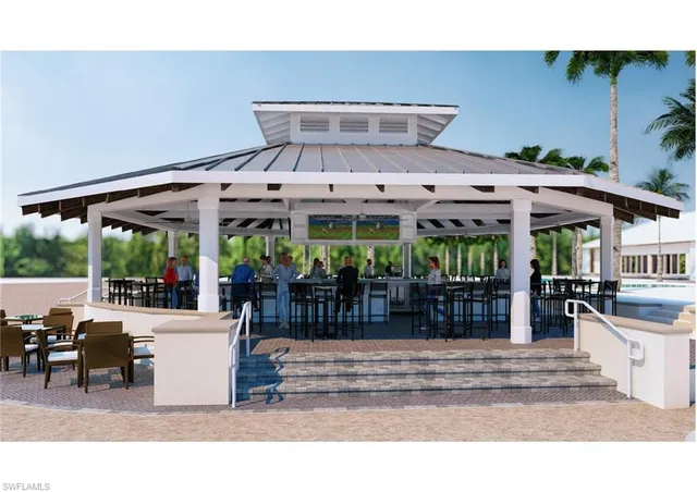 a kitchen with stainless steel appliances a stove a sink a stove and white cabinets