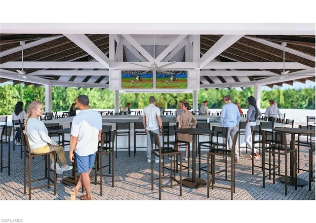 a view of a patio with a table and chairs under an umbrella