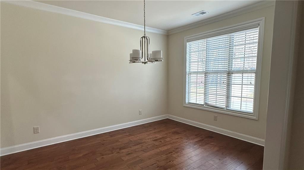 4334 Bellview Lane Duluth, GA 30097 - Photo 11 of 27 a view of a room with wooden floor and windows