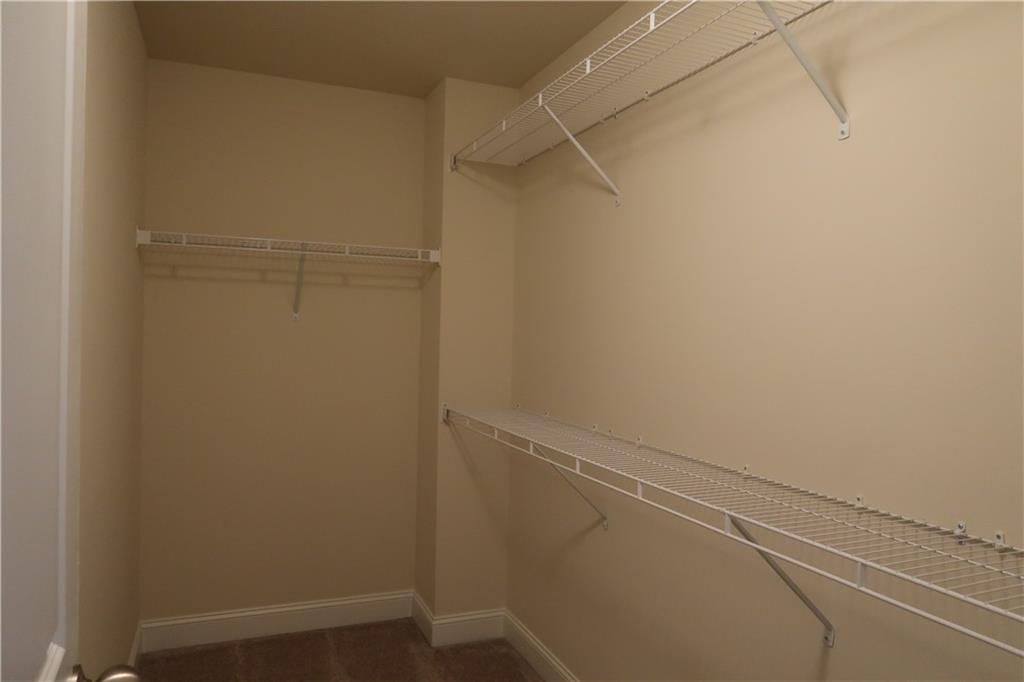 4334 Bellview Lane Duluth, GA 30097 - Photo 14 of 27 a view of a room with racks on the wall