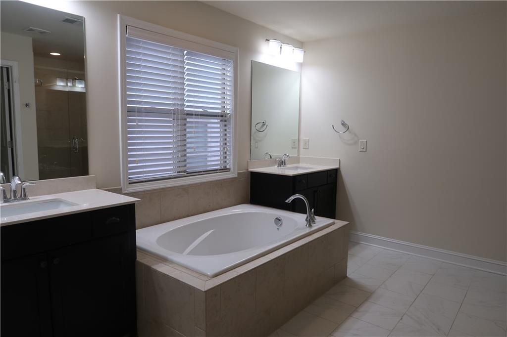 4334 Bellview Lane Duluth, GA 30097 - Photo 15 of 27 a bathroom with a sink and a bathtub
