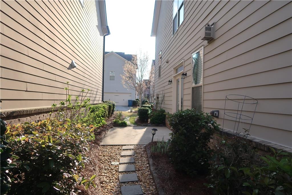4334 Bellview Lane Duluth, GA 30097 - Photo 2 of 27 a view of a backyard with plants and a garden