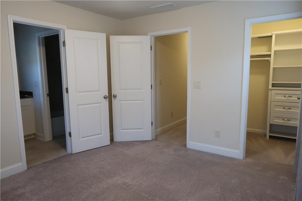 4334 Bellview Lane Duluth, GA 30097 - Photo 23 of 27 an empty room with closet