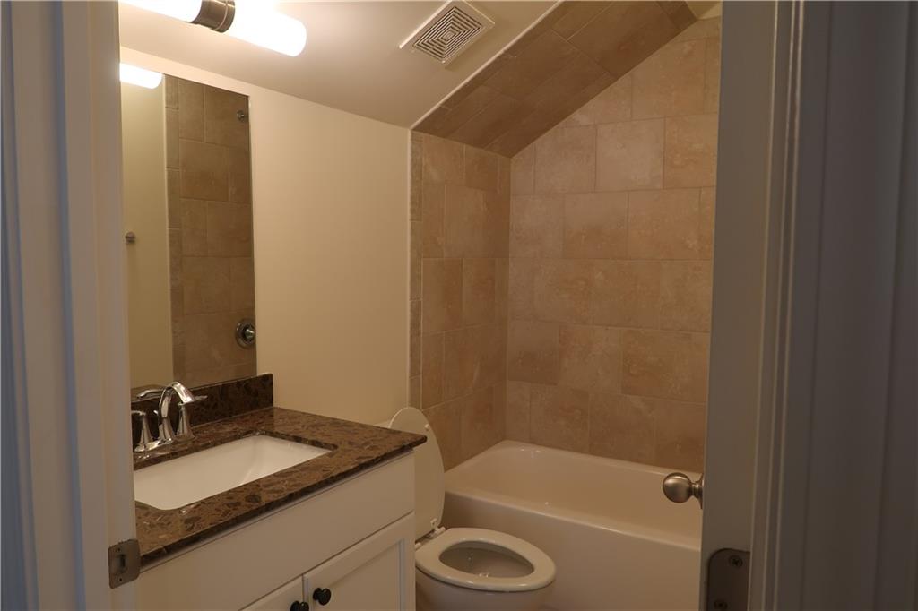 4334 Bellview Lane Duluth, GA 30097 - Photo 26 of 27 a bathroom with a granite countertop sink toilet and shower