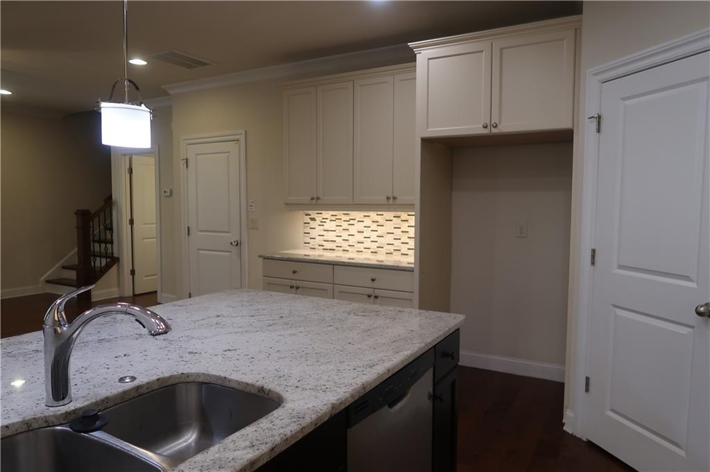 4334 Bellview Lane Duluth, GA 30097 - Photo 7 of 27 a bathroom with a granite countertop sink and a mirror
