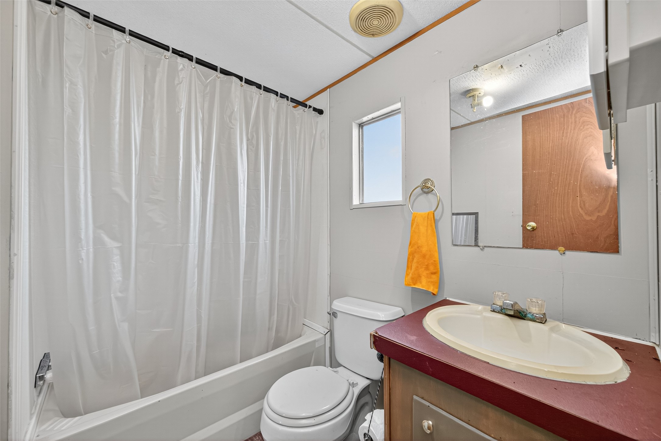 14 County Road 2400 Hull, TX 77564 - Photo 20 of 38 a bathroom with a sink toilet and shower