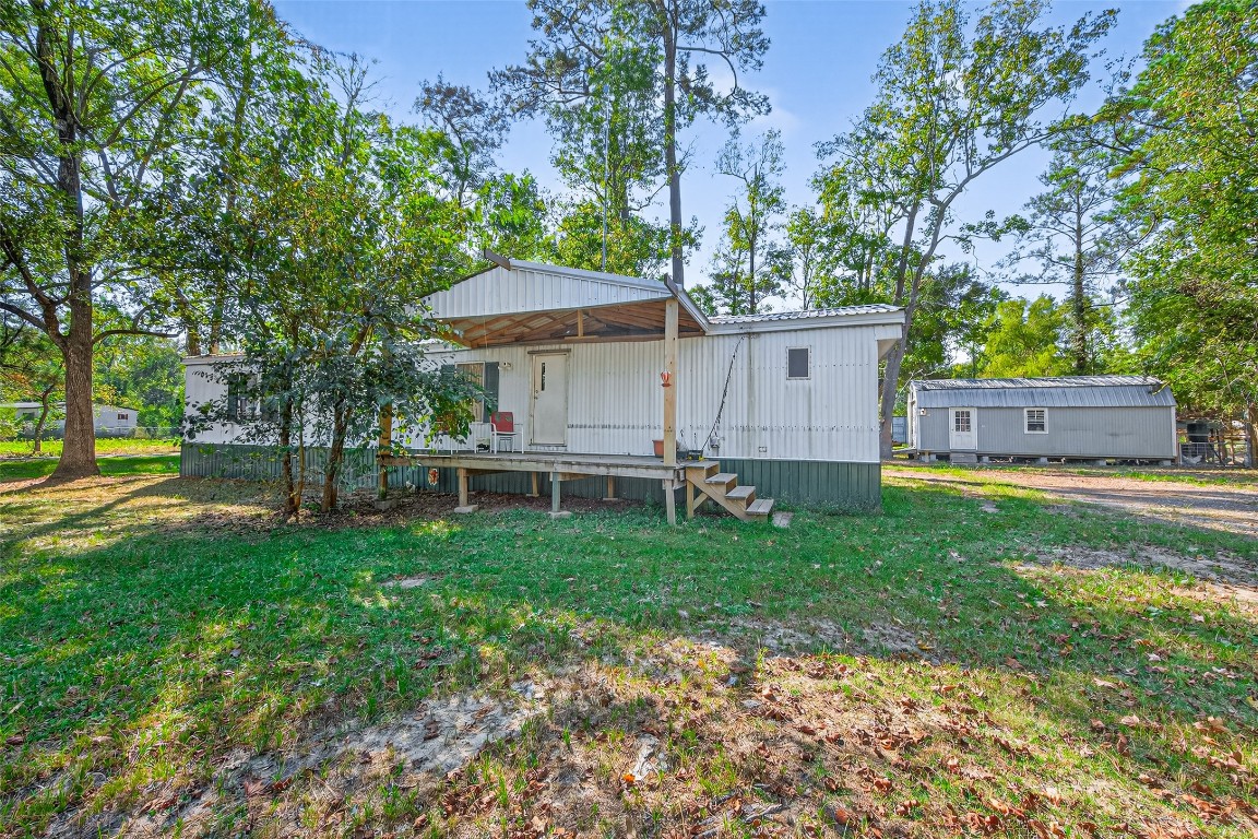 14 County Road 2400 Hull, TX 77564 - Photo 2 of 38 front view of a house with a yard