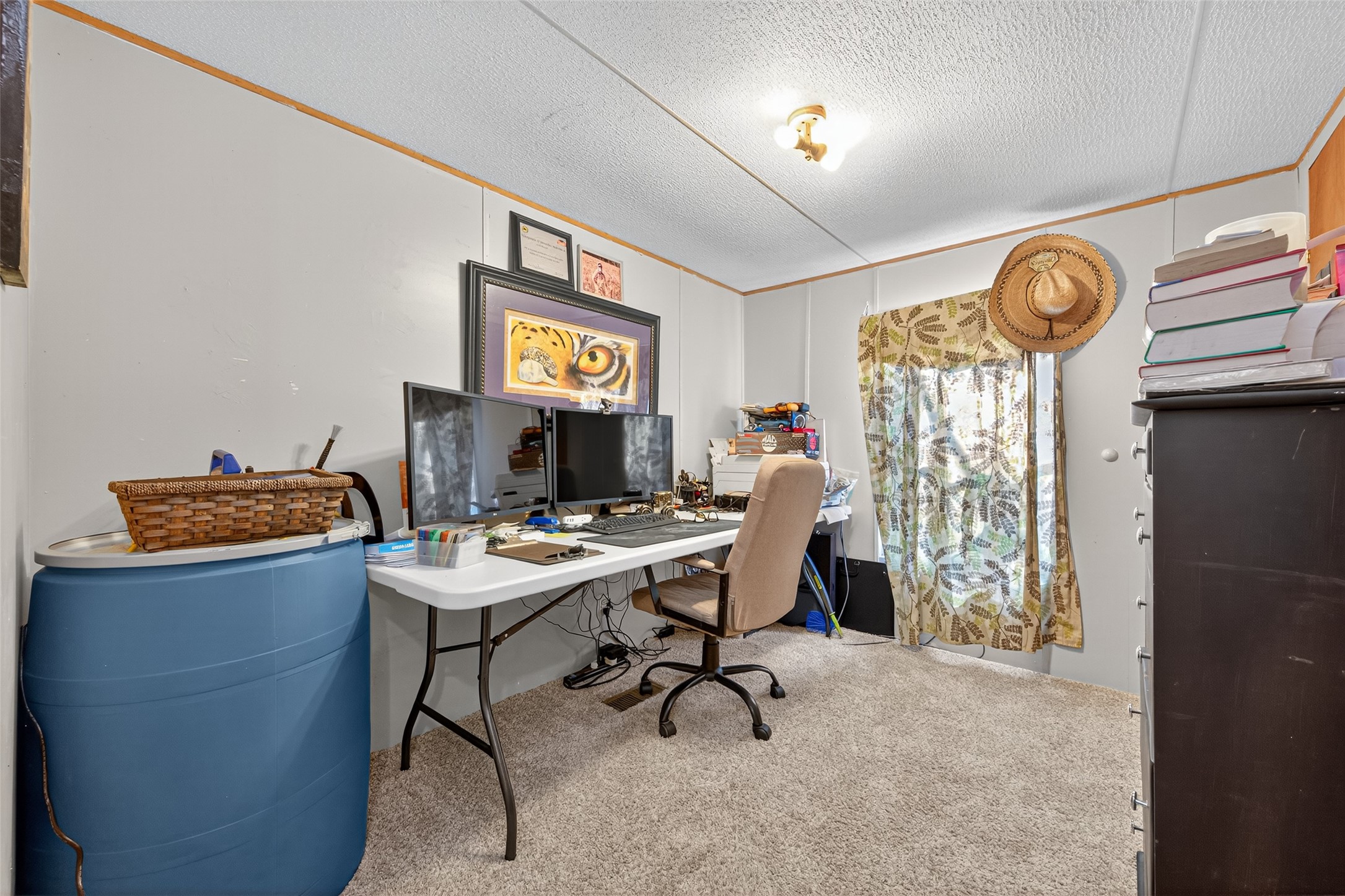 14 County Road 2400 Hull, TX 77564 - Photo 22 of 38 a view of a workspace with furniture and a window