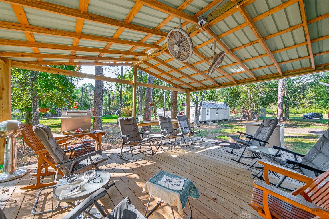 14 County Road 2400 Hull, TX 77564 - Photo 27 of 38 a view of a swimming pool with lounge chairs in patio