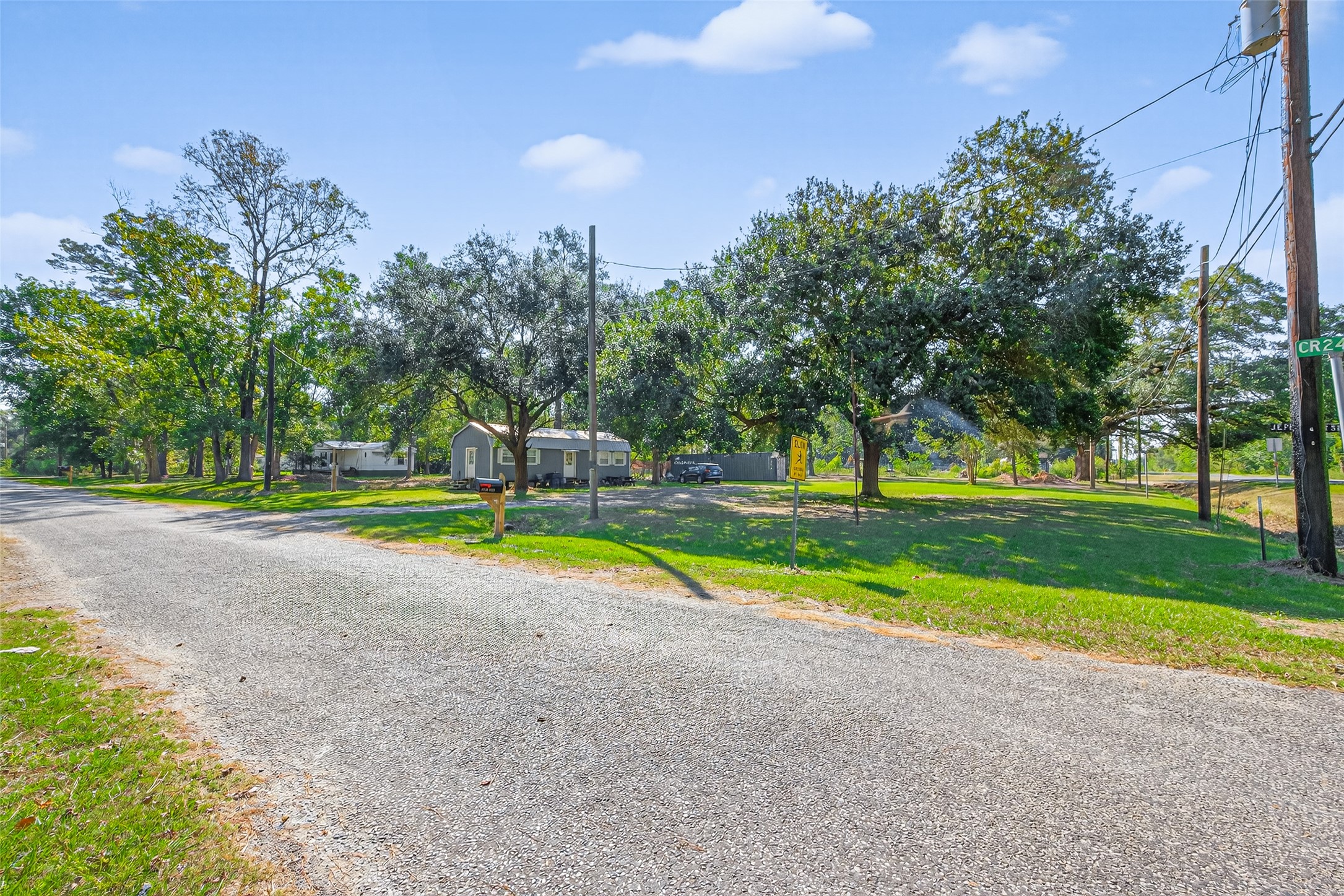 14 County Road 2400 Hull, TX 77564 - Photo 37 of 38 a view of swimming pool with a yard and large trees