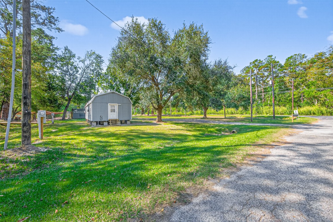 14 County Road 2400 Hull, TX 77564 - Photo 38 of 38 a front view of a house with garden