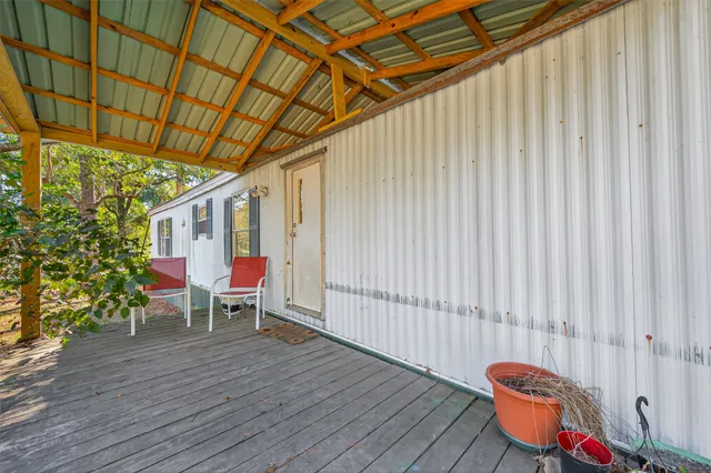 a view of a chairs in wooden deck