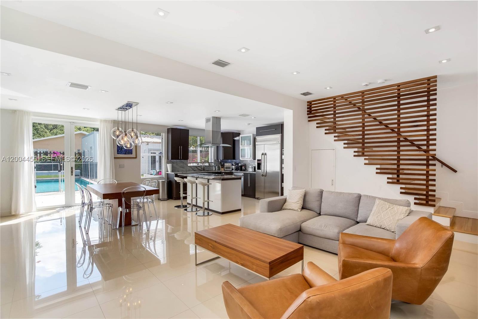 152 Southwest 20th Road Miami, FL 33129 - Photo 7 of 22 a living room with furniture kitchen view and a large window