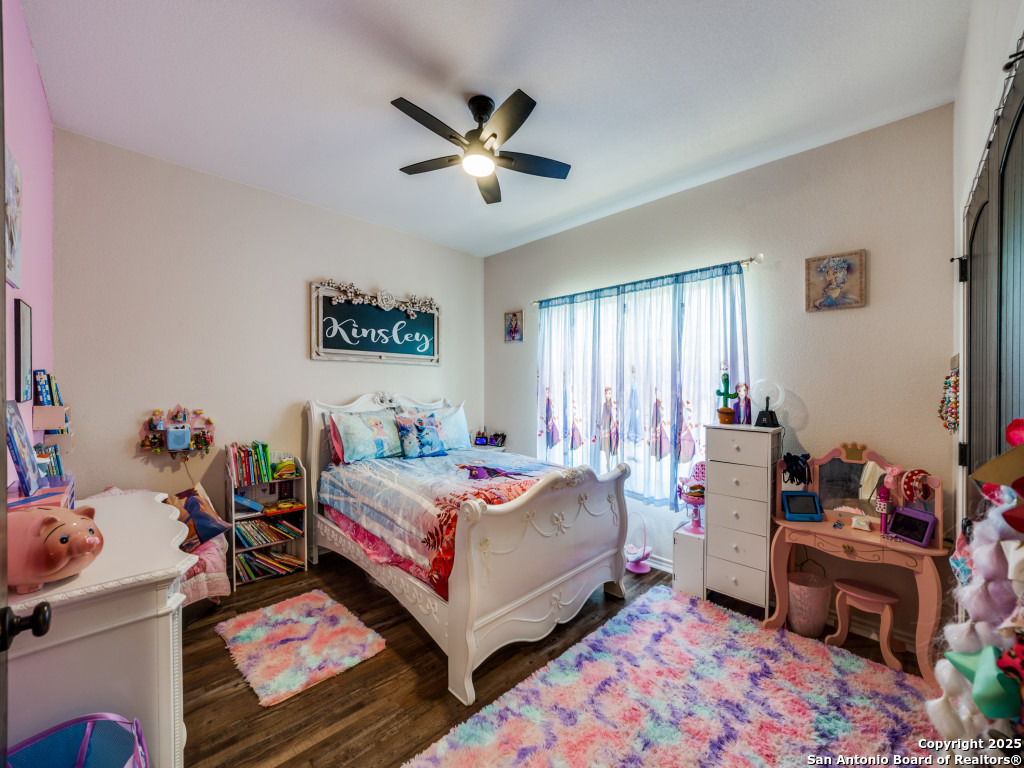 6451 Bluntzer Road Jourdanton, TX 78026 - Photo 16 of 51 a bed room with a bed and a window