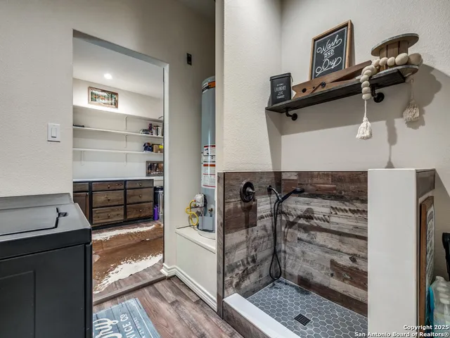 a kitchen with a refrigerator and a stove