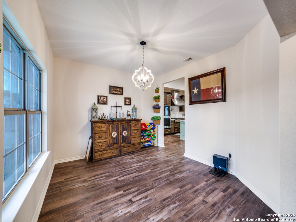 6451 Bluntzer Road Jourdanton, TX 78026 - Photo 5 of 51 a view of a livingroom with furniture and a ceiling fan