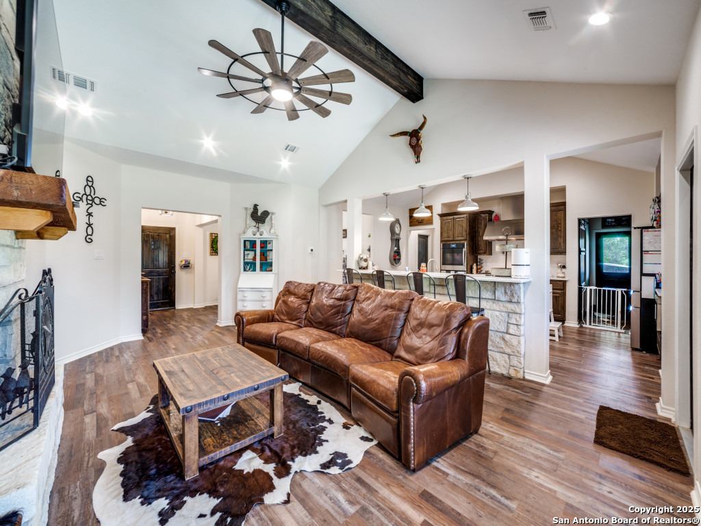 6451 Bluntzer Road Jourdanton, TX 78026 - Photo 7 of 51 a living room with furniture and wooden floor