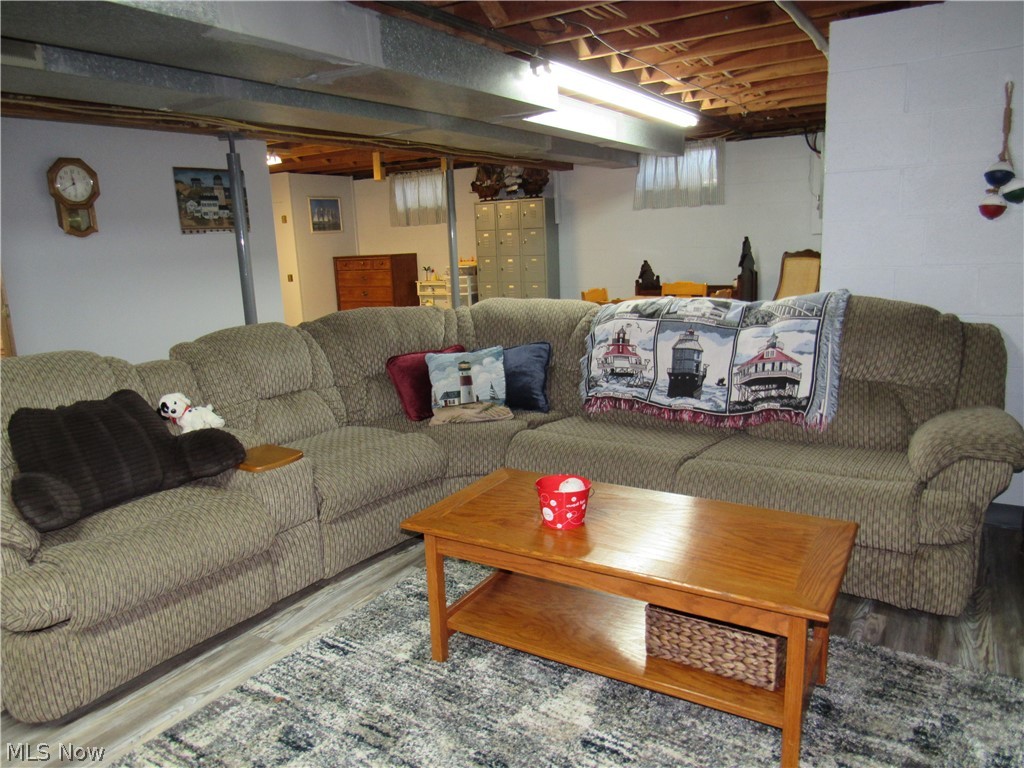 7640 Jefferson Road Ashtabula, OH 44004 - Photo 20 of 35 Basement family room with laminate floors