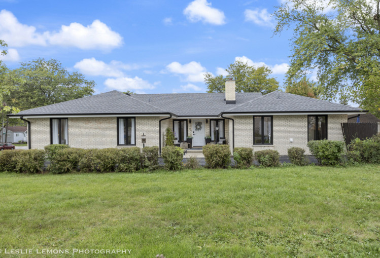 707 South Finley Road Lombard, IL 60148 - Photo 1 of 25 a view of a house with a yard and potted plants