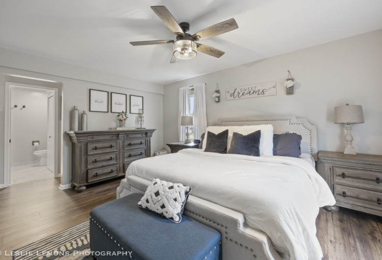 707 South Finley Road Lombard, IL 60148 - Photo 11 of 25 a bedroom with a bed and wooden floor