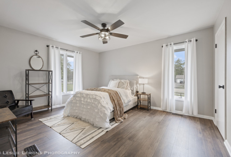 707 South Finley Road Lombard, IL 60148 - Photo 13 of 25 a bedroom with a bed and wooden floor