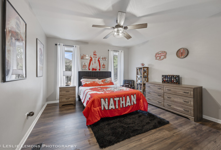 707 South Finley Road Lombard, IL 60148 - Photo 14 of 25 a bedroom with a bed and a chandelier