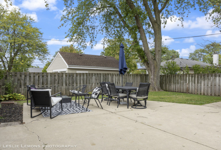 707 South Finley Road Lombard, IL 60148 - Photo 23 of 25 a view of table and chairs with wooden fence