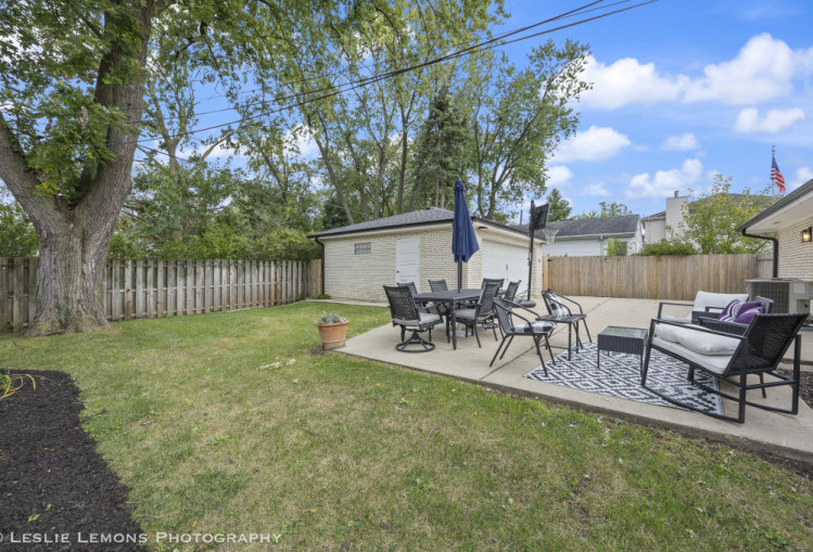 707 South Finley Road Lombard, IL 60148 - Photo 24 of 25 a view of a backyard with a garden and outdoor seating