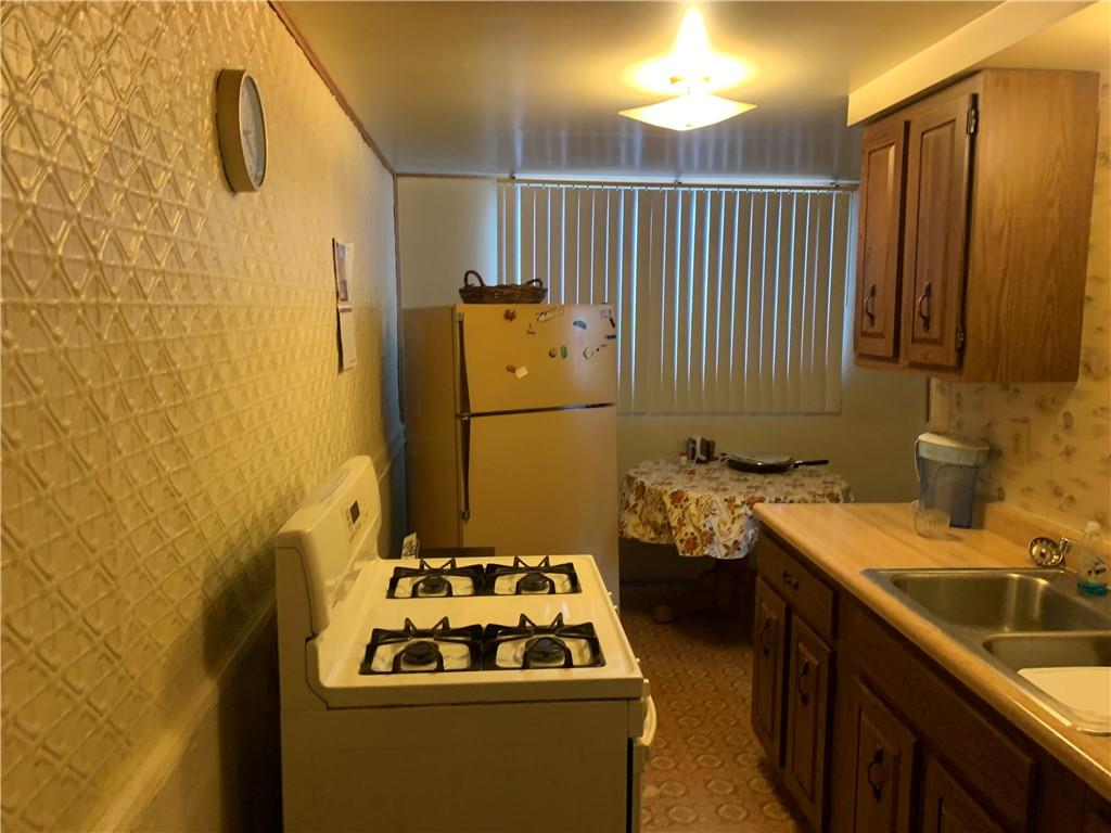 255 Southern Avenue Pittsburgh, PA 15211 - Photo 15 of 25 a bathroom with a sink a toilet and shower