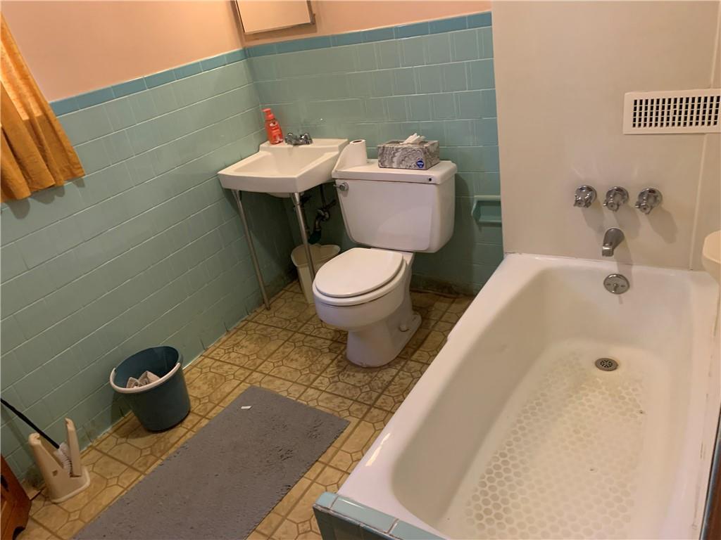 255 Southern Avenue Pittsburgh, PA 15211 - Photo 17 of 25 a bathroom with a sink and a toilet