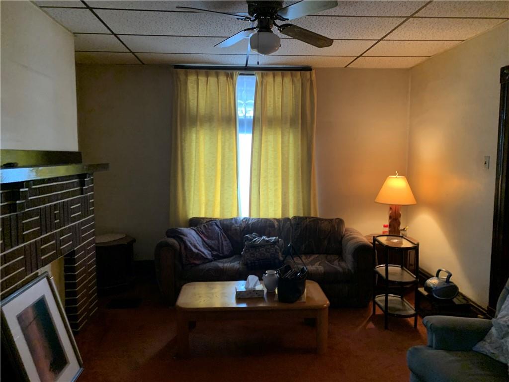 255 Southern Avenue Pittsburgh, PA 15211 - Photo 3 of 25 a living room with furniture and a chandelier