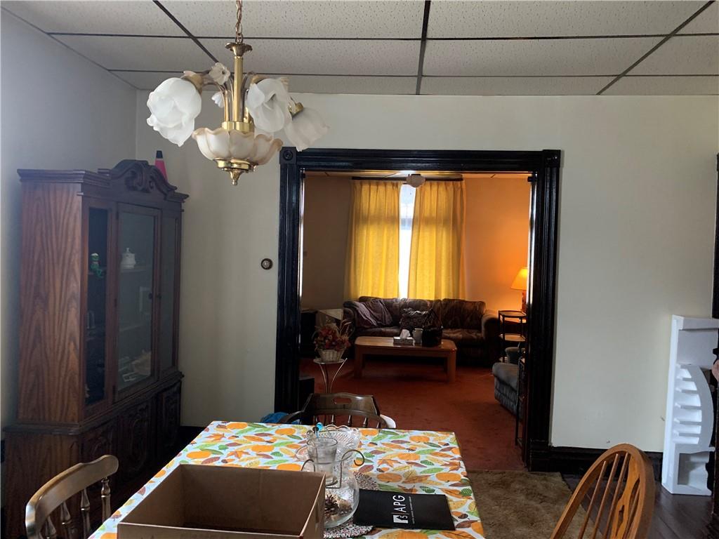 255 Southern Avenue Pittsburgh, PA 15211 - Photo 4 of 25 a bedroom with bed and a chandelier