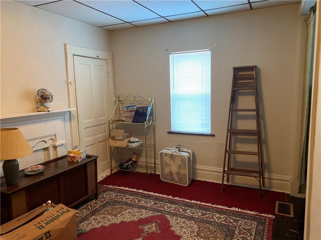 255 Southern Avenue Pittsburgh, PA 15211 - Photo 8 of 25 a bedroom with a bed and wooden floor