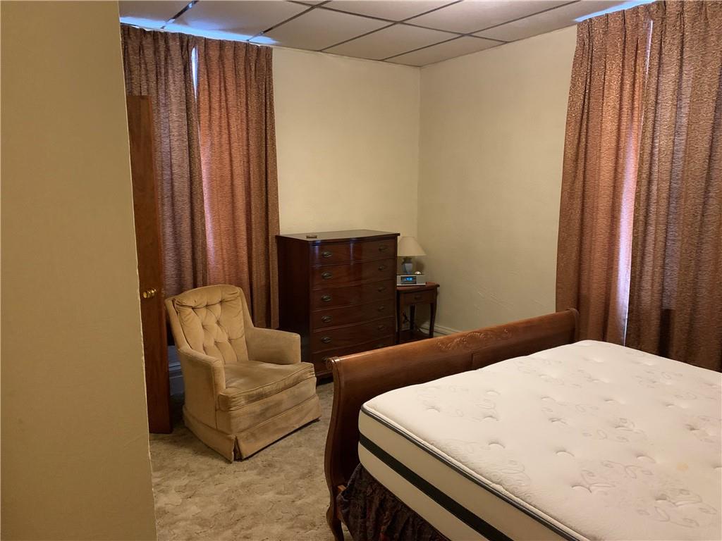 255 Southern Avenue Pittsburgh, PA 15211 - Photo 9 of 25 a bedroom with a bed and a window