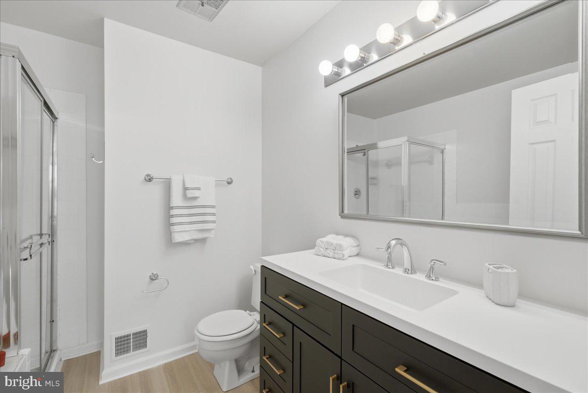 8902 Winding Hollow Way Springfield, VA 22152 - Photo 15 of 34 Sleek full bath with modern finishes.