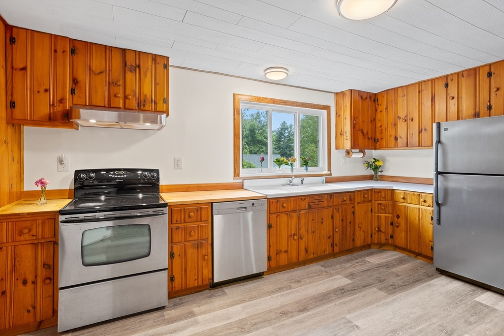 69 East Road Westminster, MA 01473 - Photo 5 of 17 a kitchen with a stove a sink and a refrigerator