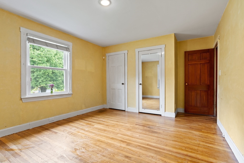 69 East Road Westminster, MA 01473 - Photo 8 of 17 a view of an empty room with wooden floor and a window