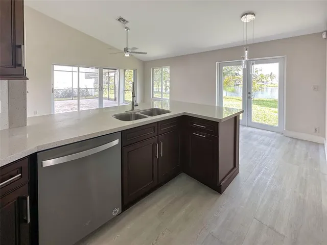 a kitchen with a sink and wooden cabinets