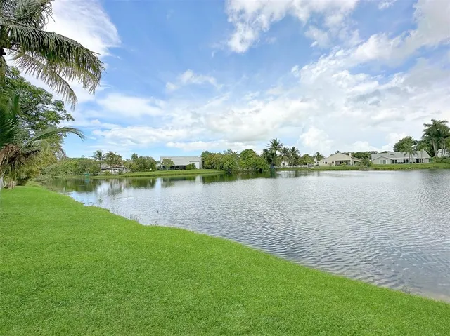 an aerial view of a house with yard swimming pool and outdoor seating
